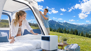 Bright ventilated tent interior in an alpine meadow